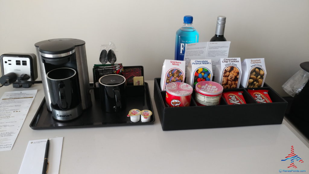 a coffee maker and coffee mugs