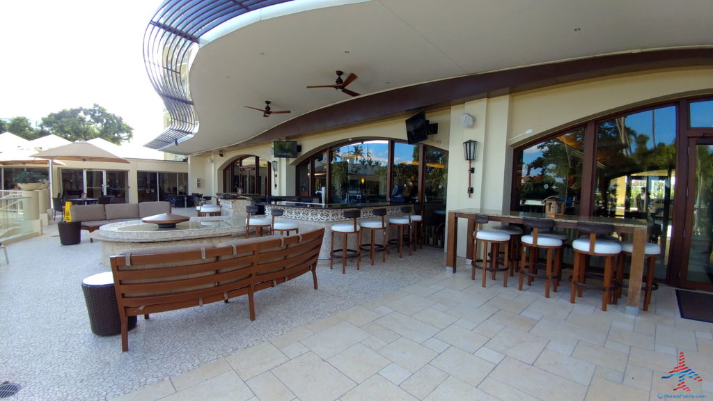 a patio with chairs and tables