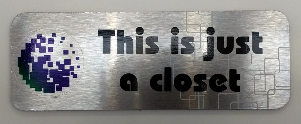 a metal sign with black text