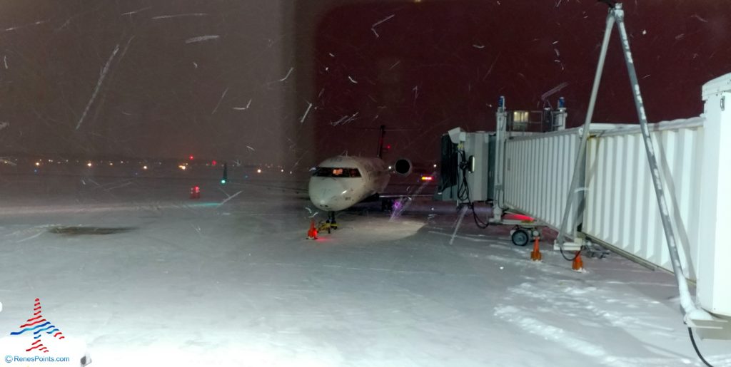 a plane parked on a snowy runway