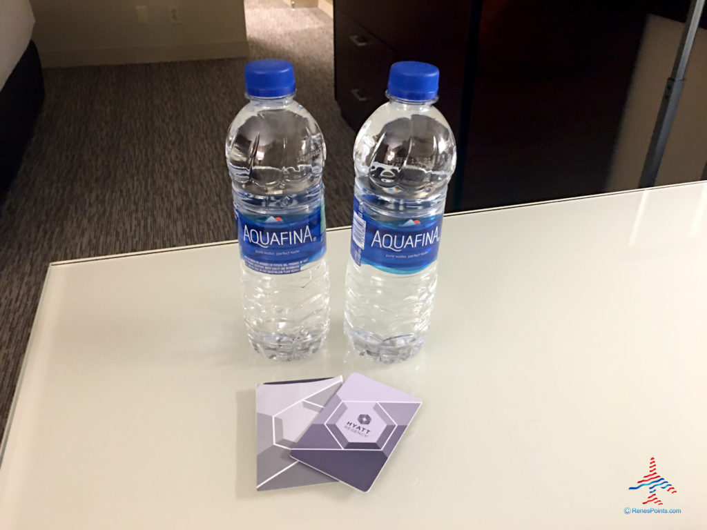 Complimentary bottles of water for a World of Hyatt elite status member are seen in an executive king bedroom at the Hyatt Regency O'Hare Chicago airport hotel in Rosemont, Illinois.