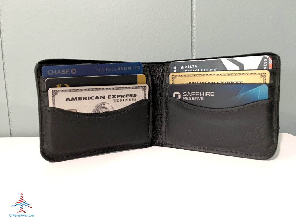 Some of the best travel credit cards are seen inside a wallet.
