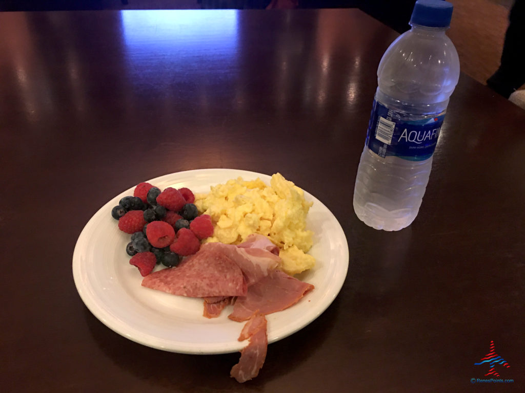Breakfast meat, berries, eggs, and a bottle of Aquafina water are seen in the Regency Club lounge at the Hyatt Regency O'Hare Chicago airport hotel in Rosemont, Illinois.