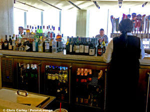 Liquor, wine, and beer are seen at the United Club LAX airport lounge in Los Angeles, California. © Chris Carley / PointsLounge.
