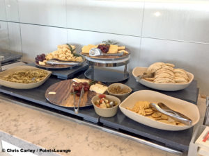 Cheese, crackers, and grapes are displayed at the United Club LAX airport lounge in Los Angeles, California. © Chris Carley / PointsLounge.