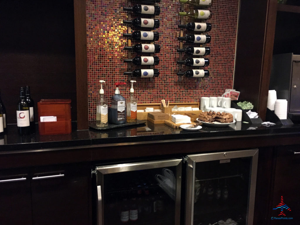 Wine bottles, dessert, and beer are displayed inside the Regency Club lounge at the Hyatt Regency O'Hare Chicago airport hotel in Rosemont, Illinois.
