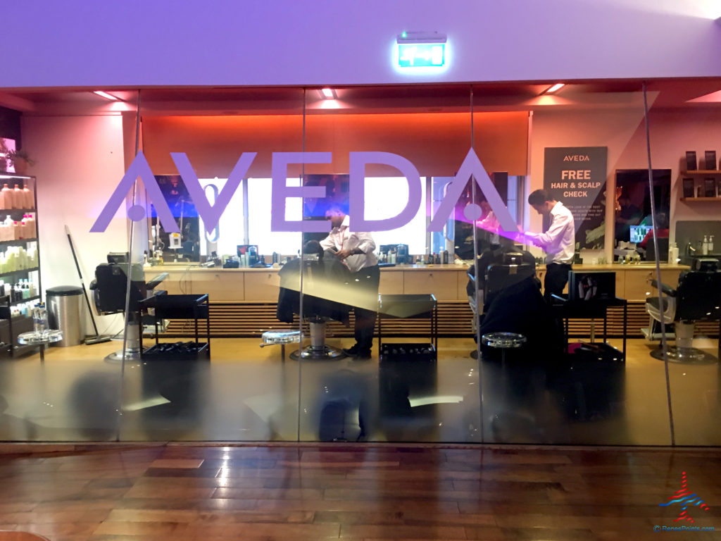 Guests receive hairstyling services at the Aveda salon inside the Virgin Atlantic Clubhouse airport lounge at London Heathrow Airport (LHR).