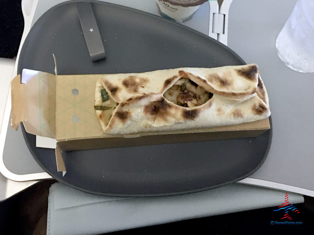 A barbecue chicken wrap is featured as part of Delta's Main Cabin international experience as seen on a Delta Air Lines Airbus A330-300 flight from London Heathrow to Atlanta Hartsfield Airport.