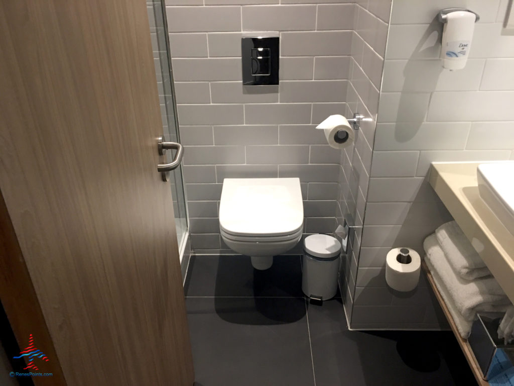 The bathroom toilet is seen inside a room at the Holiday Inn Express London Heathrow T4 (LHR airport hotel) in Hounslow, United Kingdom.