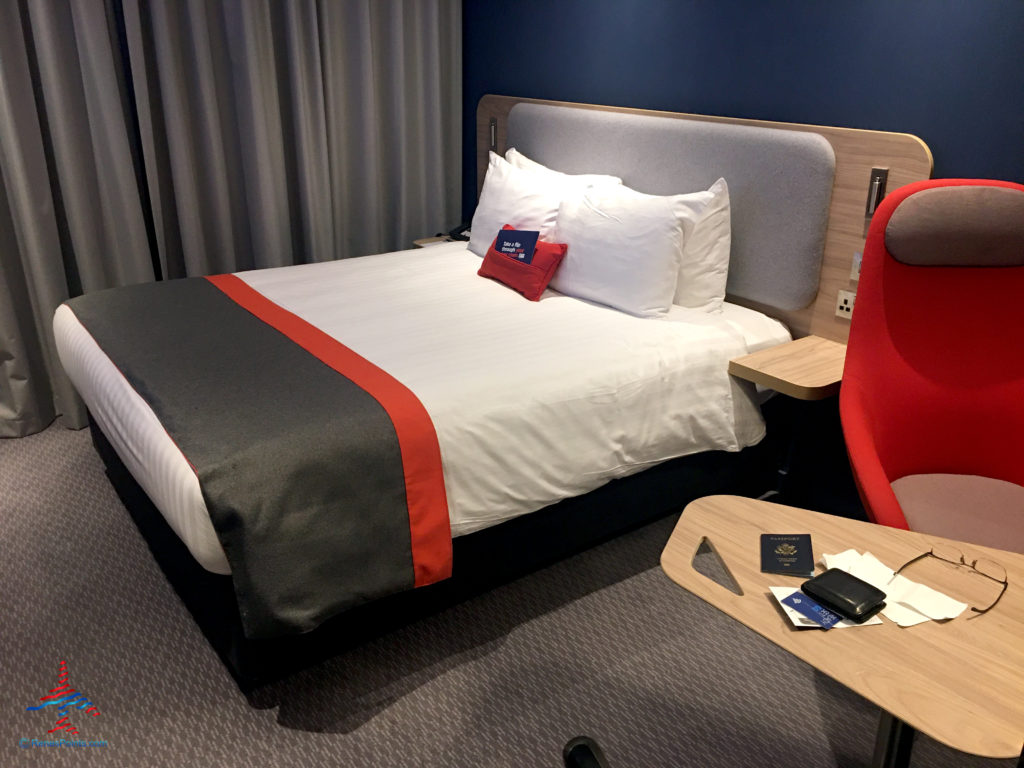 A double bed is seen inside a room at the Holiday Inn Express London Heathrow T4 (LHR airport hotel) in Hounslow, United Kingdom.