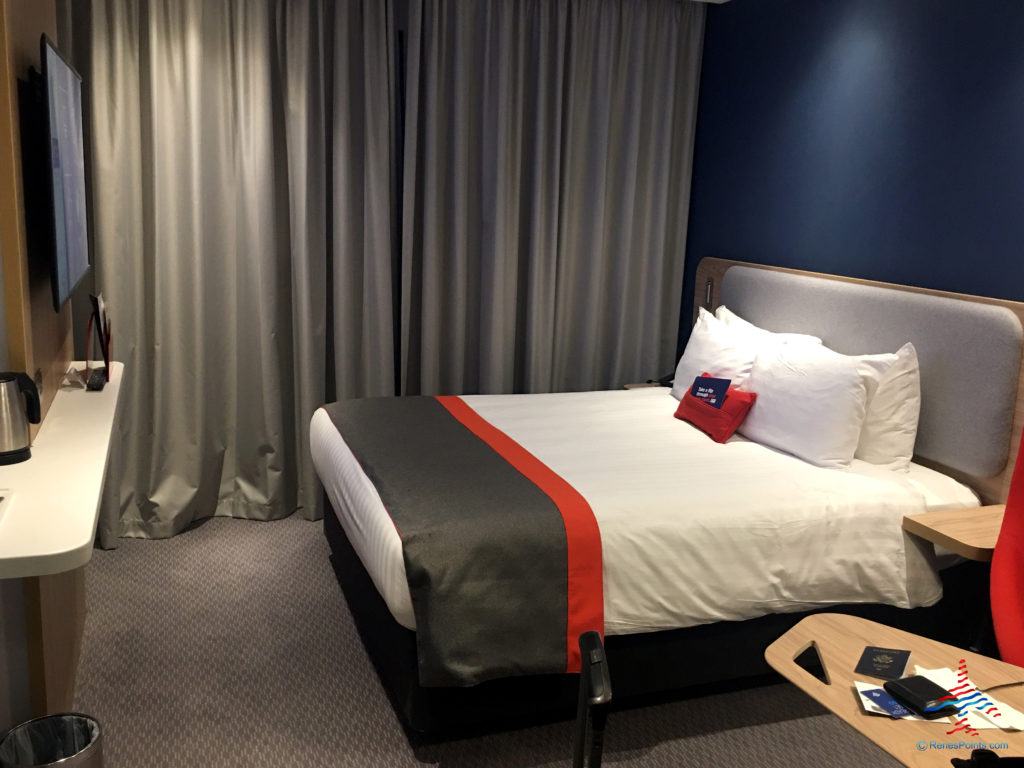 A television and double bed are seen inside a room at the Holiday Inn Express London Heathrow T4 (LHR airport hotel) in Hounslow, United Kingdom.