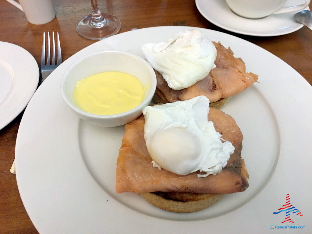 Eggs Royale (salmon Benedict) breakfast is served at the Virgin Atlantic Clubhouse airport lounge at London Heathrow Airport (LHR).