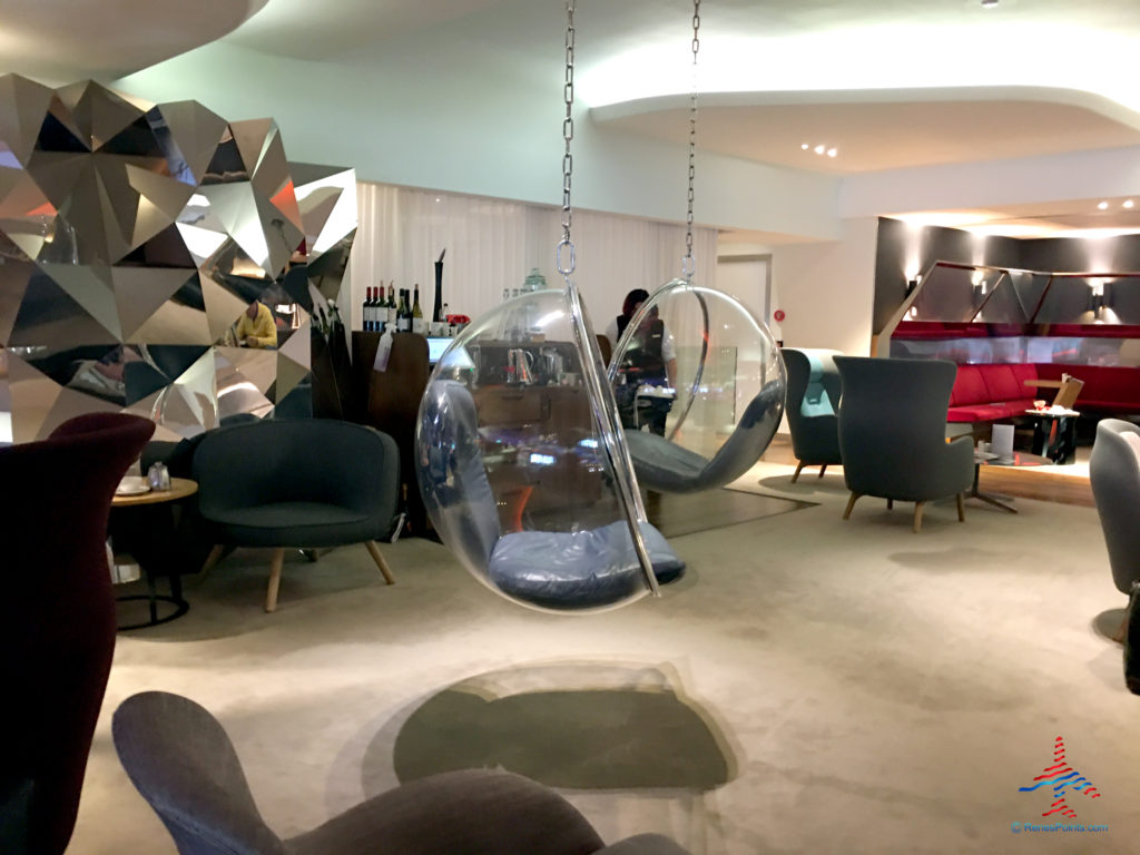 Suspended chairs are seen inside the Virgin Atlantic Clubhouse airport lounge at London Heathrow Airport (LHR).