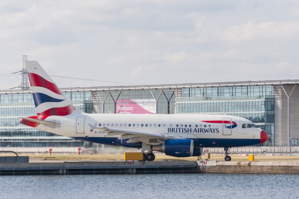 LONDON, UK - AUGUST, 2 2013; A British Airways Airbus A-318 (G-EUNB) rolls on the runway of the London City Airport in the borough of Newham before take off