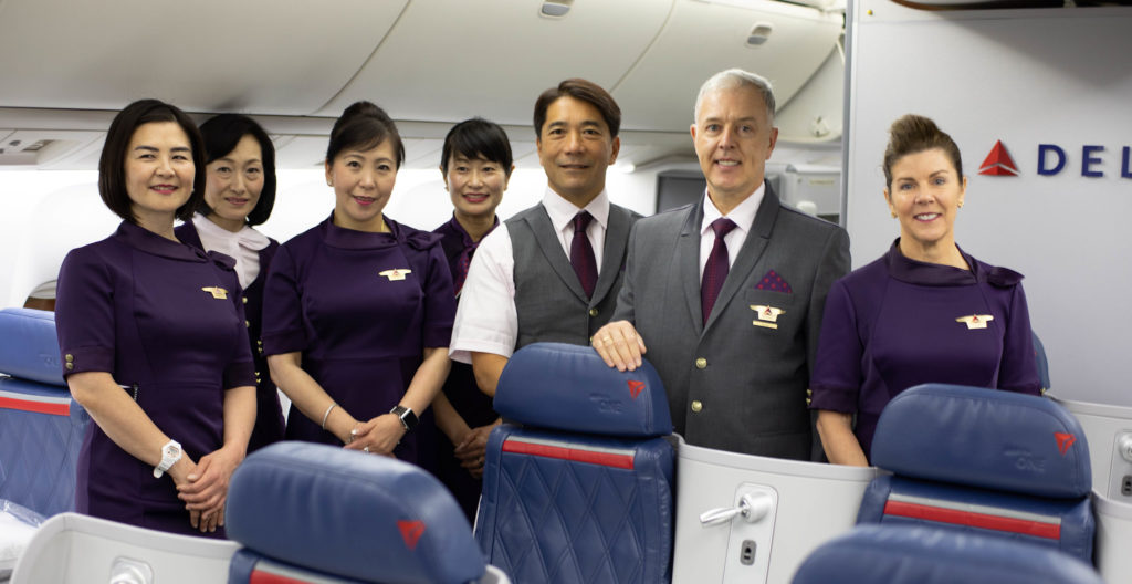 a group of people standing in a plane