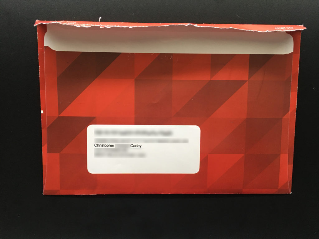 An opened/tampered Delta SkyMiles Select envelope