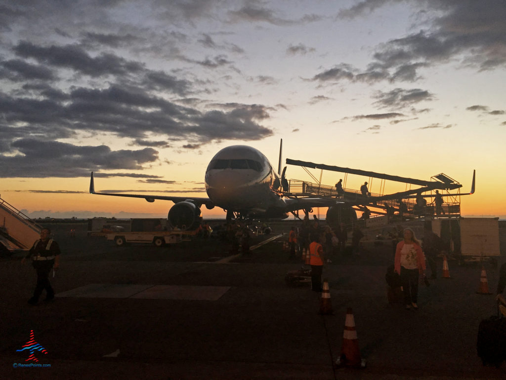 The sun sets behind a Delta 757 at Kona, Hawaii (KOA). We took this picture on a trip paid with Delta SkyMiles!