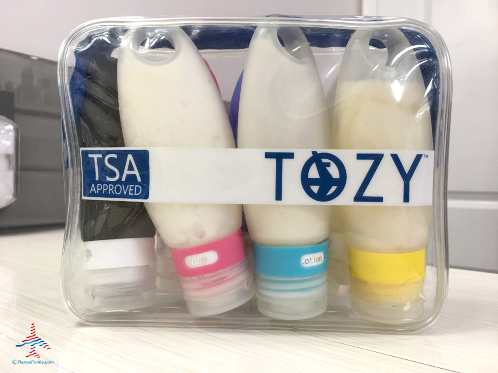 Leakproof, silicone, reusable toiletry tubes are seen in a Tozy clear toiletry bag.