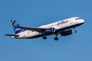 New York, USA - April 30, 2012: Airbus A320 JetBlue approaches John F. Kennedy International Airport in New York, NY on April 30, 2012. The A320 was the first narrow body airliner from Airbus. It is the biggest competition to Boeing 737NG.