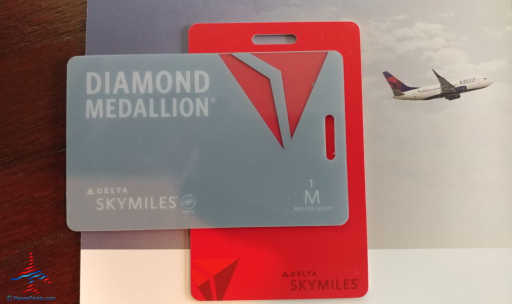 a red and grey card with a picture of an airplane