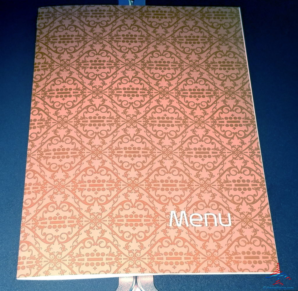 a menu on a blue surface