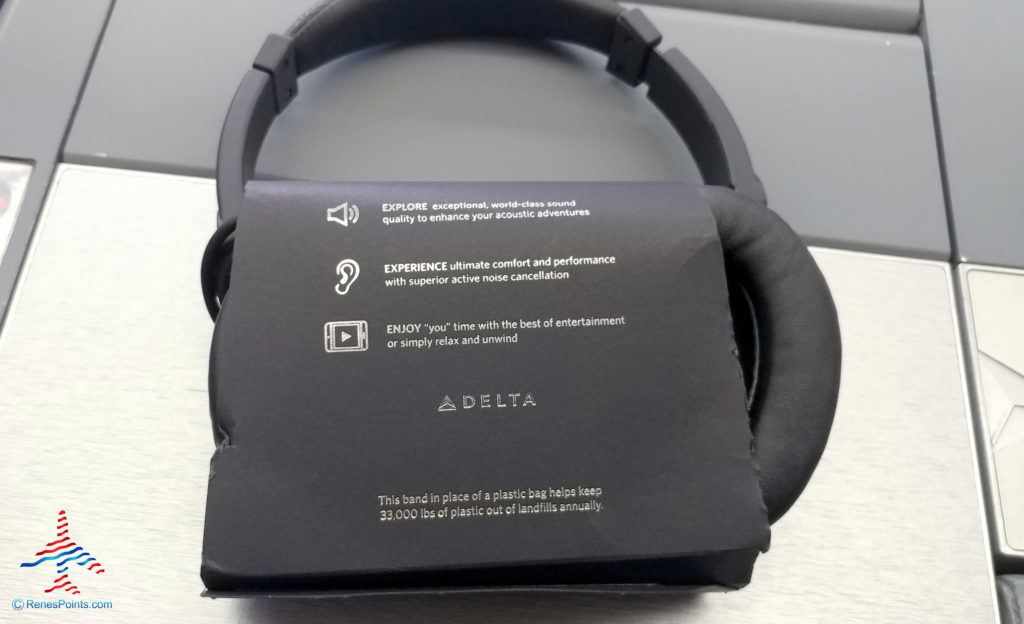 a black headphones with a black box