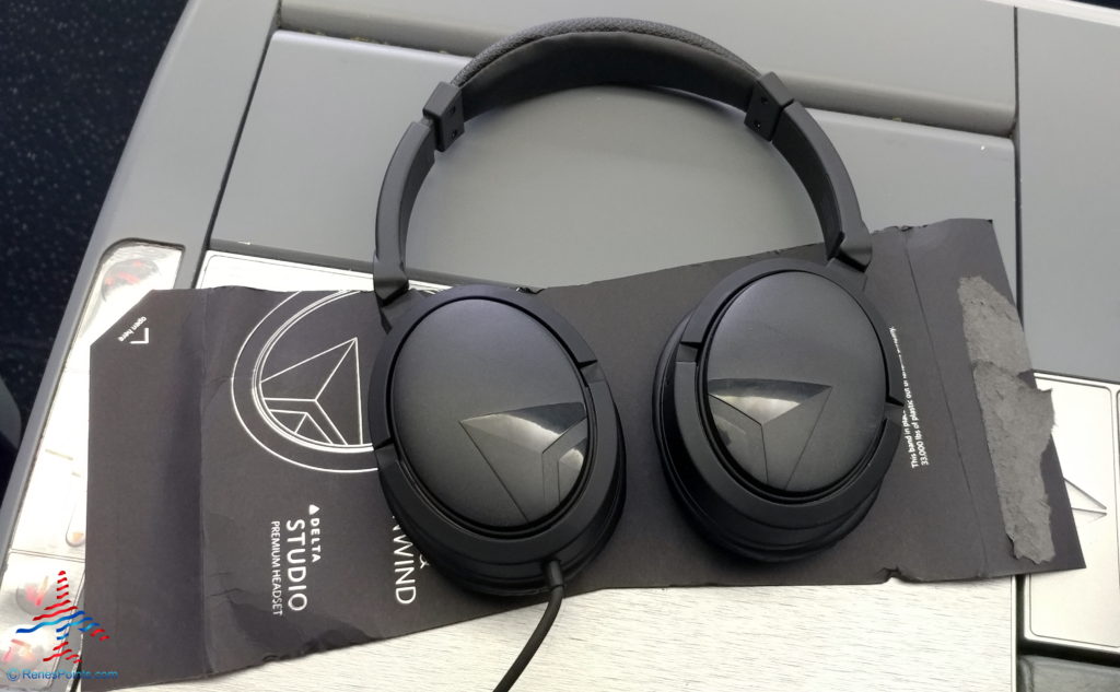 a pair of black headphones on a black surface