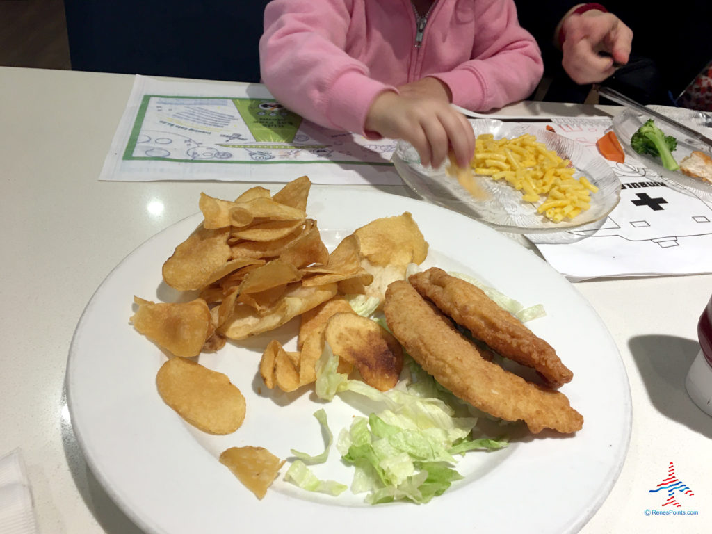 Chicken fingers, chips, and mac & cheese from the kids' menu are served at Onyx Restaurant inside the Holiday Inn & Suites Anaheim hotel near Disneyland in Anaheim, California.