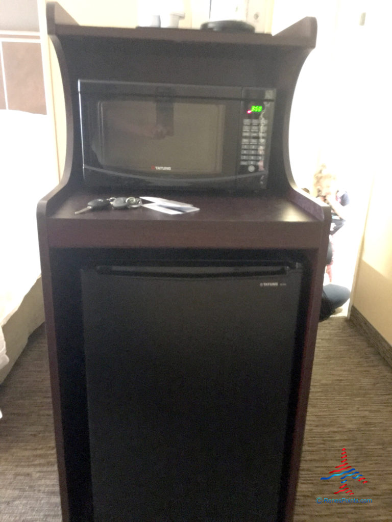 The microwave and mini-fridge are seen inside a guest room at the Holiday Inn & Suites Anaheim hotel near Disneyland in Anaheim, California.