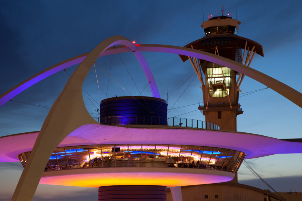 Theme Building and tower of Los Angeles International Airport at dusk