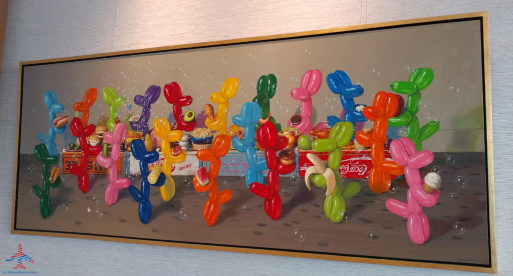 a painting of balloons in a frame