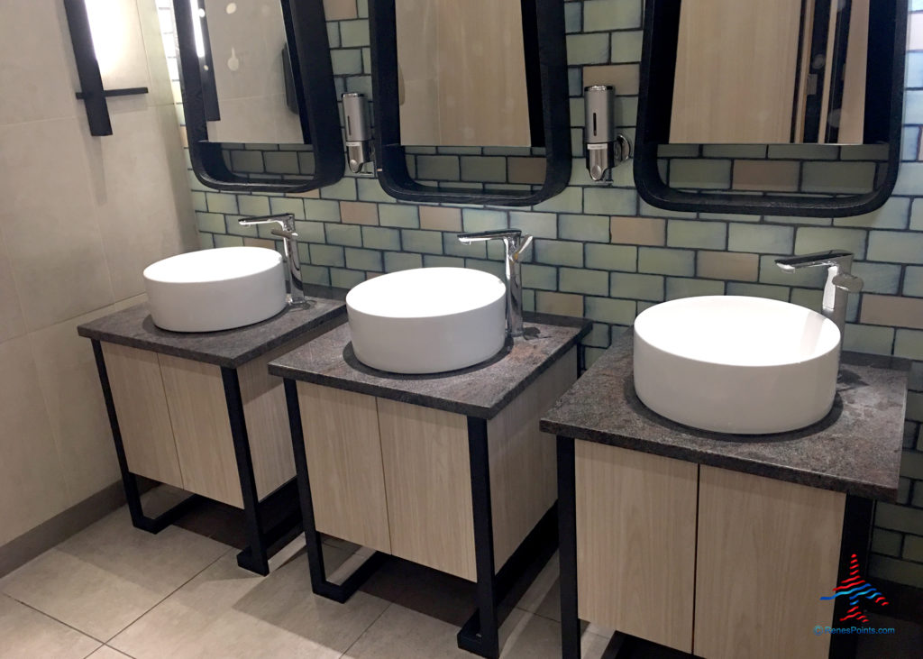 Restroom sinks are seen at the Plaza Premium Arrivals Lounge at London Heathrow Airport Terminal 4.