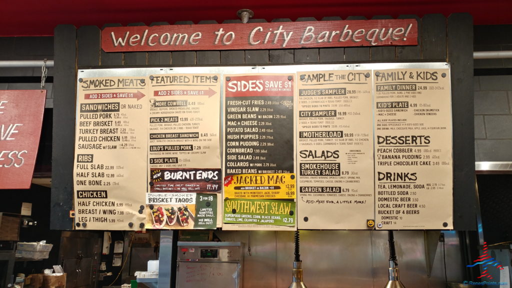 a menu board with a sign above it