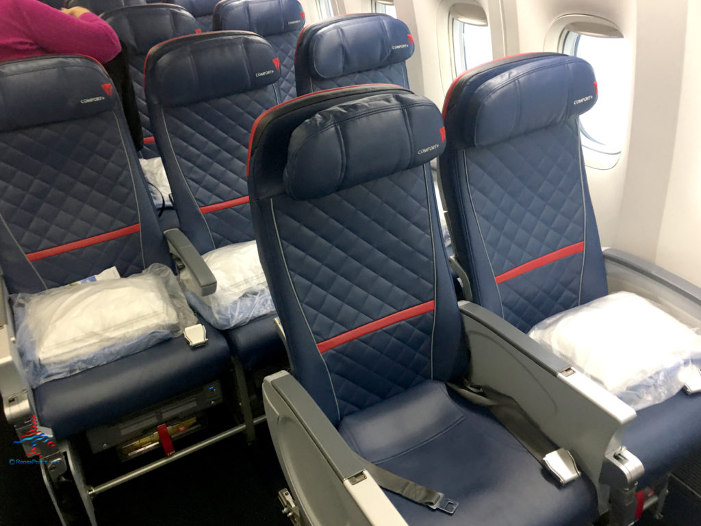 Rows 30 and 31 on a Delta Air Lines 777-200ER are seen before a flight from Paris (CDG) to Los Angeles (LAX). Seats 30A, 30B, 31A, 31B, and 31C in the Comfort+ cabin are pictured.