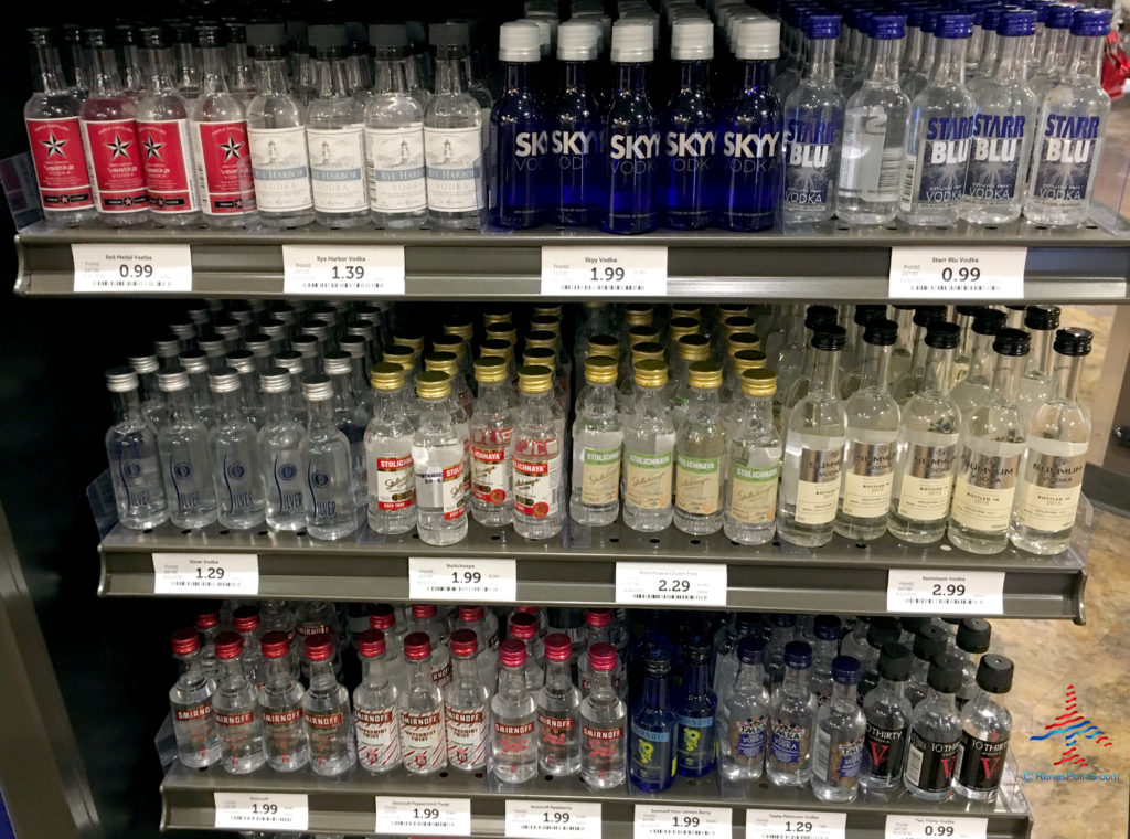 a shelf with bottles of liquid