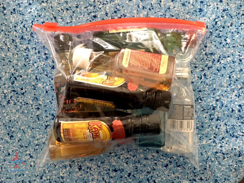 "Airplane"/mini bottles of liquor are seen in a sealed Ziplock bag.