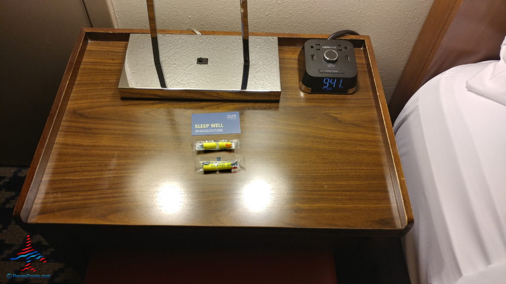 a table with a clock and some pills