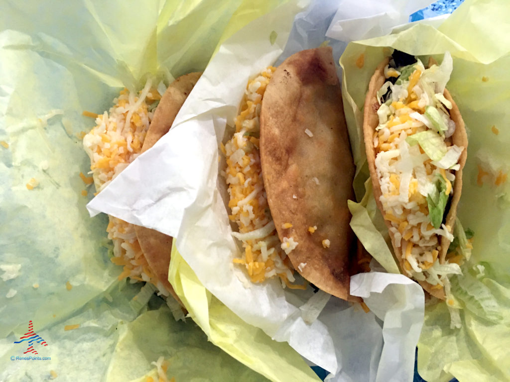 Three tacos from a take out or delivery restaurant.