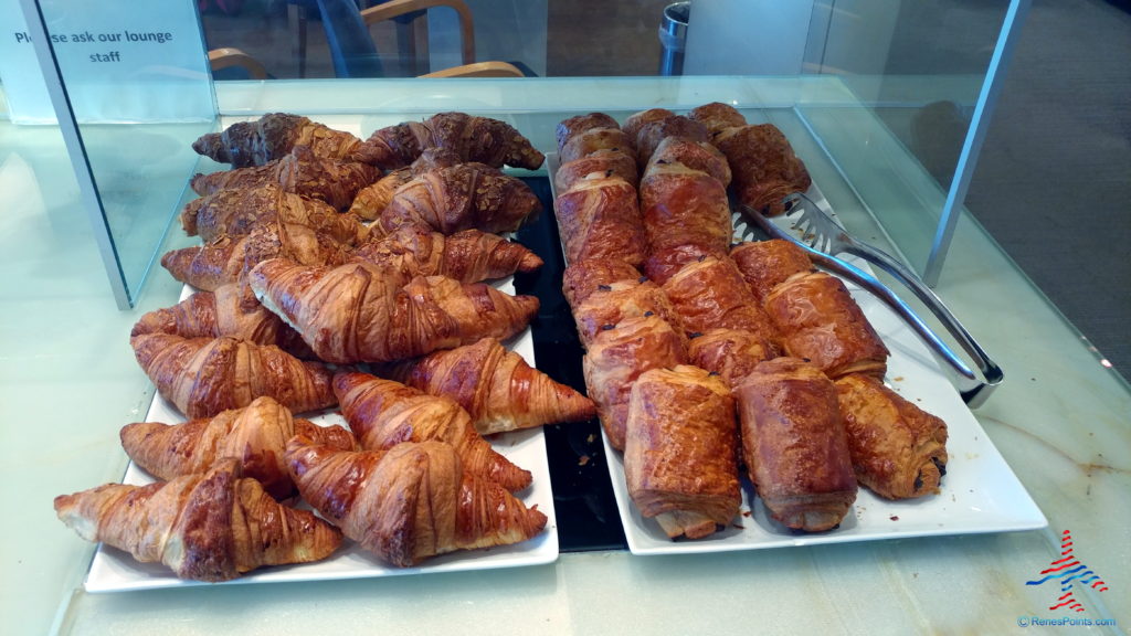 a group of croissants on plates