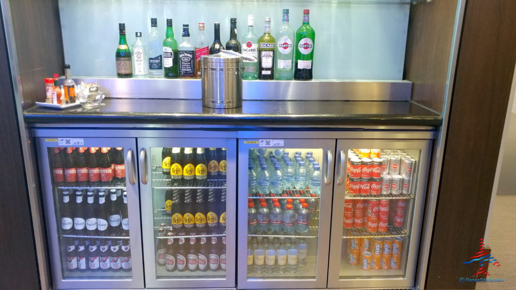 a fridge with bottles of beverages