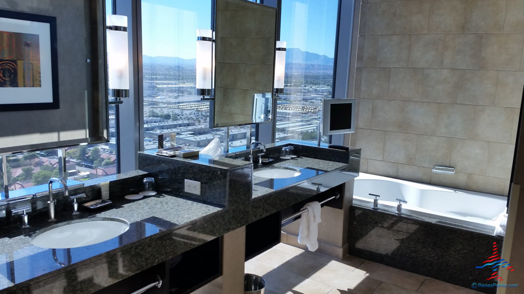 The bathroom looks toward the west side of Las Vegas from inside a Salon Suite hotel room at Palms Casino Resort in Las Vegas, Nevada.