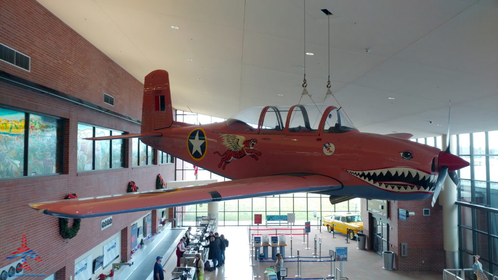 a red airplane from the ceiling