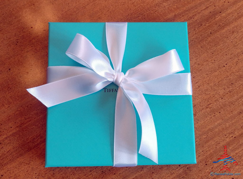 a blue box with a white ribbon