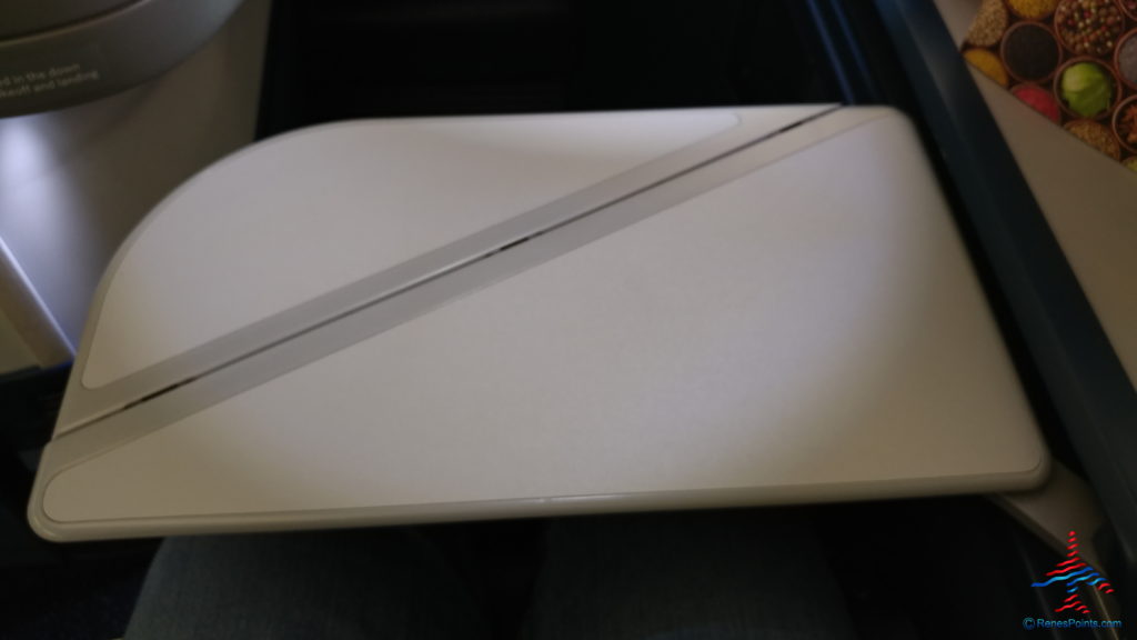 a white laptop on a person's lap