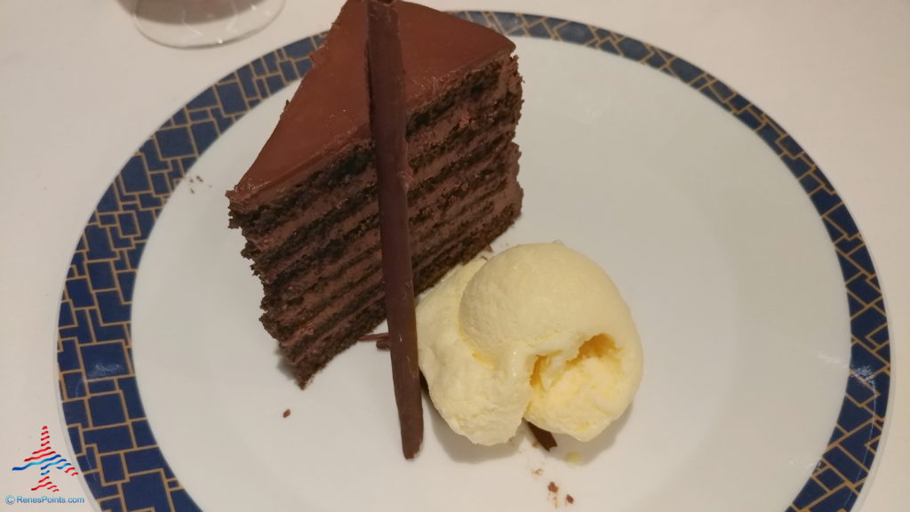 a slice of chocolate cake and ice cream on a plate