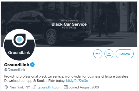 a black car with a logo on it