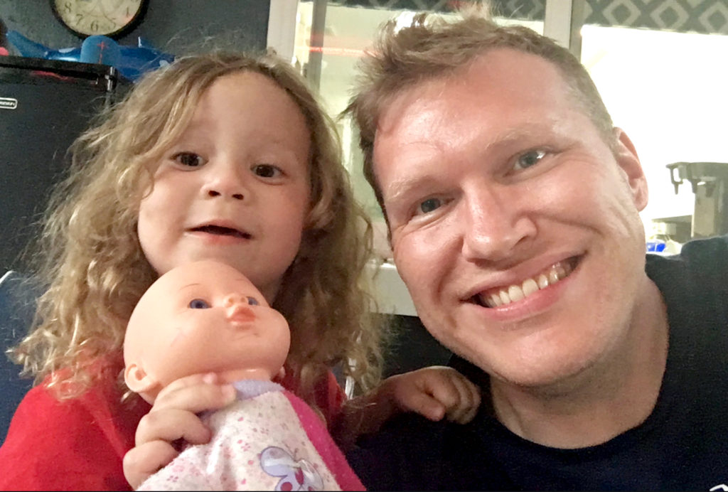 Blogger Chris Carley and his daughter. And her doll.