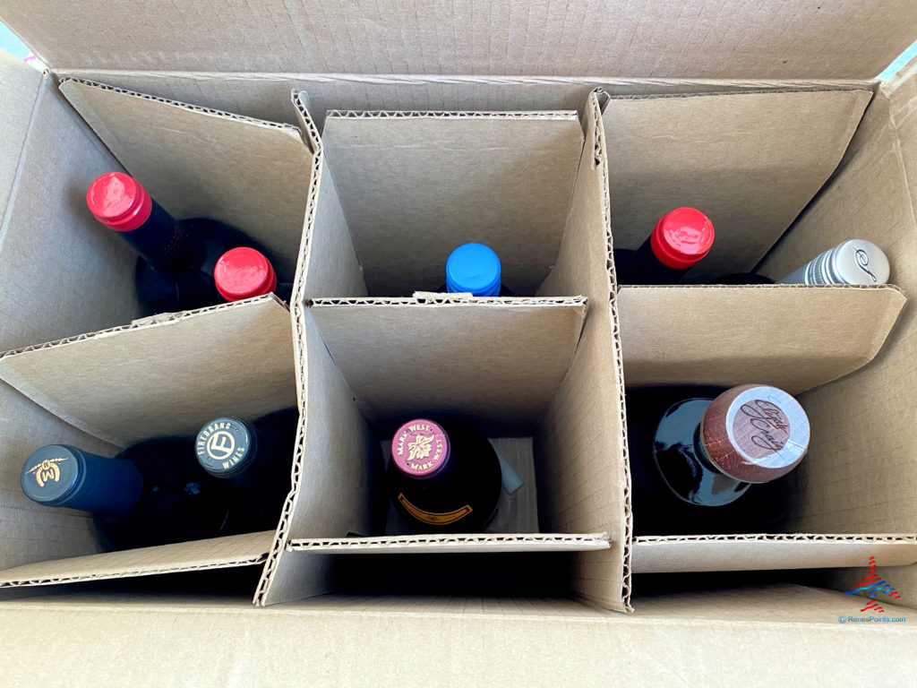 An order of white wine, red wine, and bourbon picked up from Total Wine.