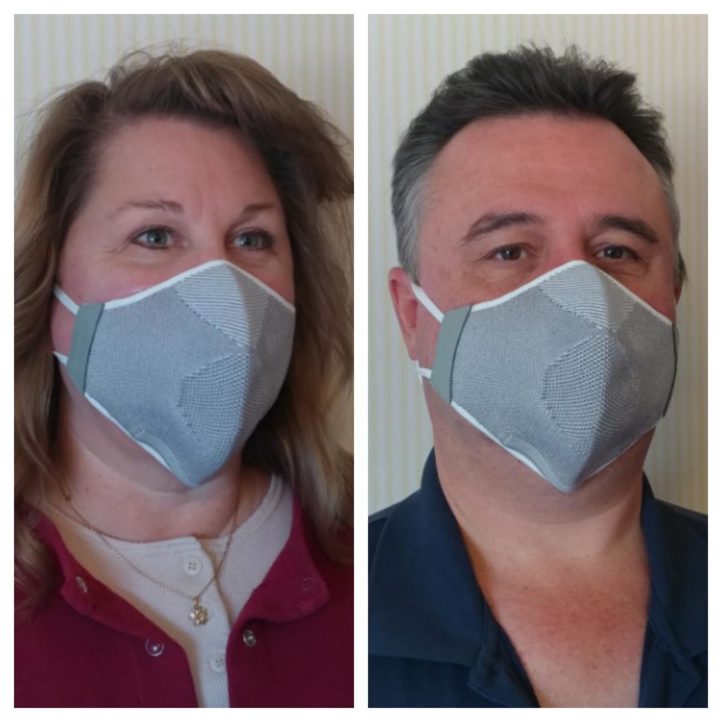 a man and woman wearing a face mask