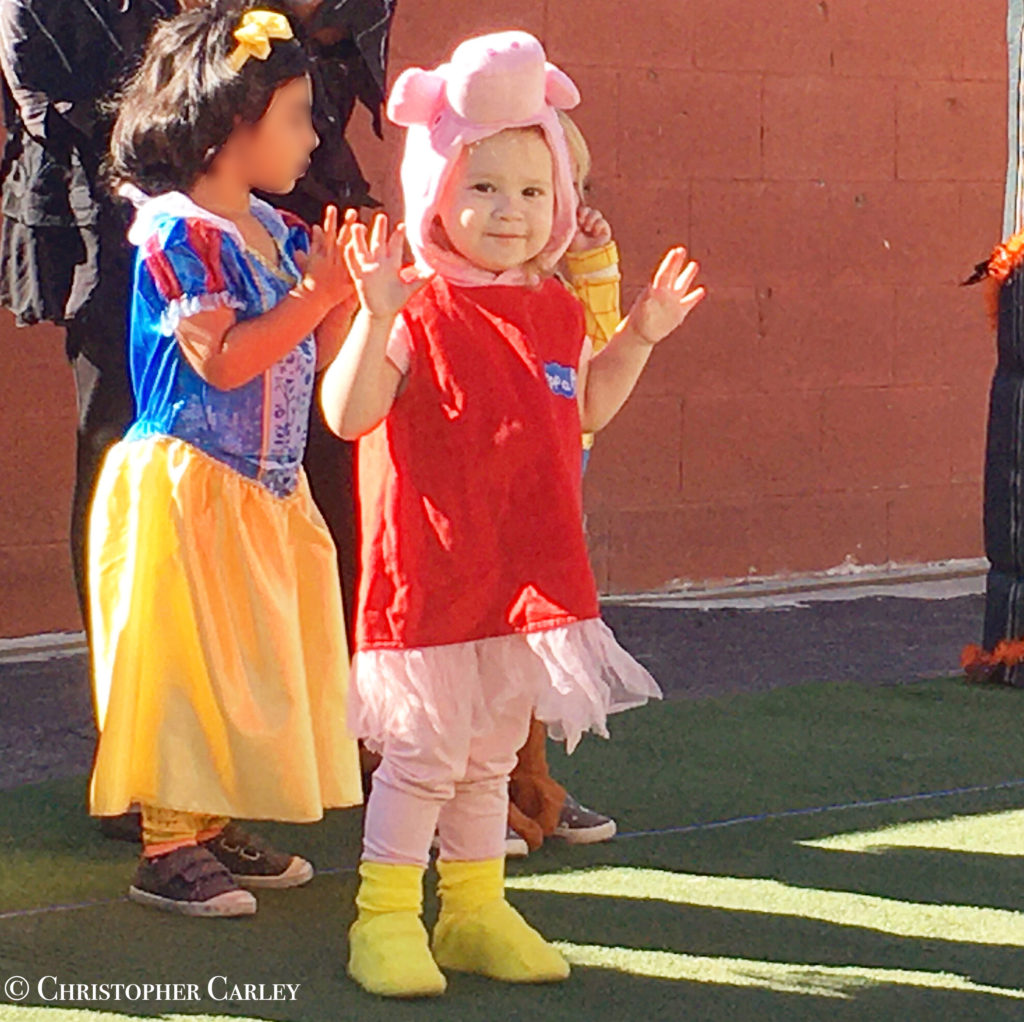 Little girl in a Peppa Pig Halloween costume.